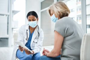 Medical professional talking with a newly acquired patient thanks to Medical SEO.